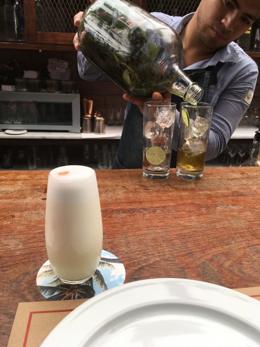 Cocktail Bar at El Mercado - Bartender Making a Pisco Sour