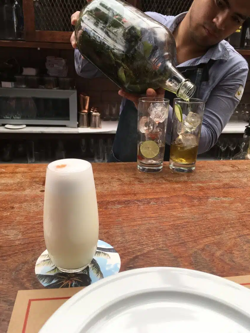 Cocktail Bar at El Mercado - Bartender Making a Pisco Sour