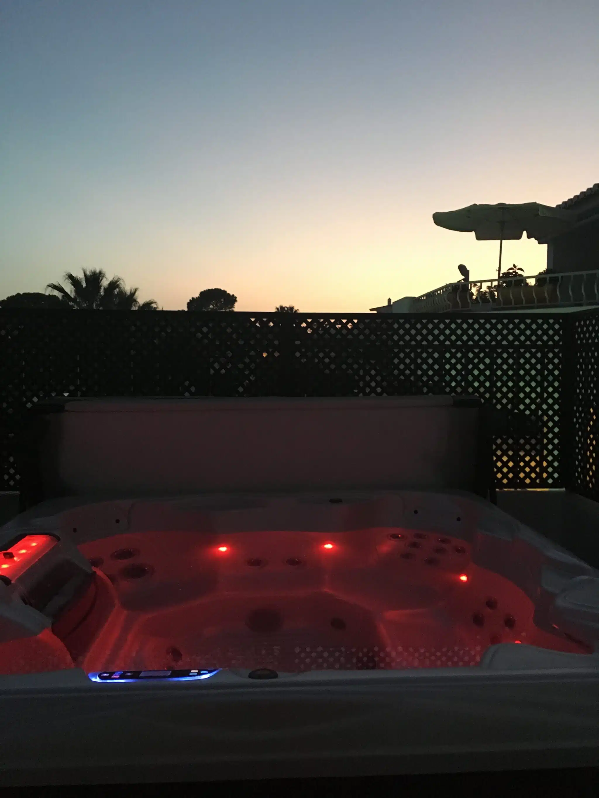 A private jacuzzi glowing red after dark on a villa terrace at Four Seasons Fairways, Quinta do Lago