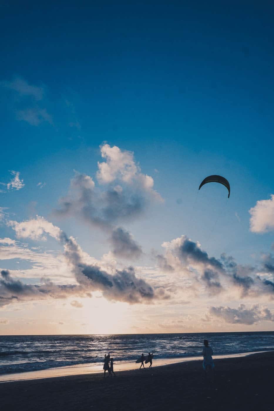 Kitesurfers on the beach in Canggu