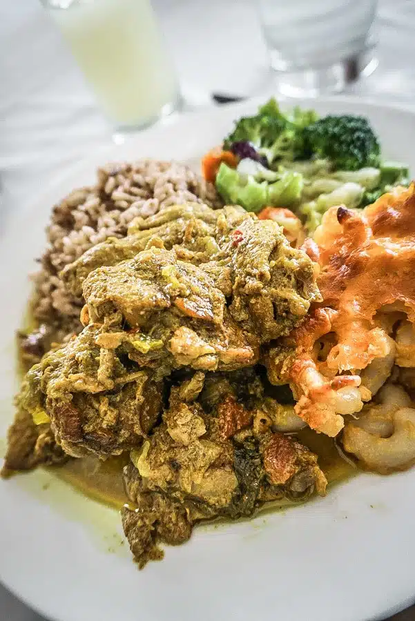 Curried chicken and macaroni pie. Dreaming of a Caribbean vacation? Nevis is the coolest island in the Caribbean - with a laid-back aesthetic, gorgeous beaches, vibrant culture and cool style and amazing food. Check out my foodie's guide to what to eat and drink in Nevis #travel #caribbean #traveldestinations