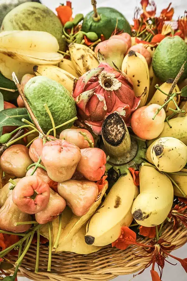 Tropical fruit in Nevis. Dreaming of a Caribbean vacation? Nevis is the coolest island in the Caribbean - with a laid-back aesthetic, gorgeous beaches, vibrant culture and cool style and amazing food. Check out my foodie's guide to what to eat and drink in Nevis #travel #caribbean #traveldestinations