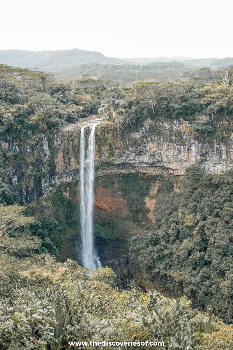 The waterfall drops into a basin 