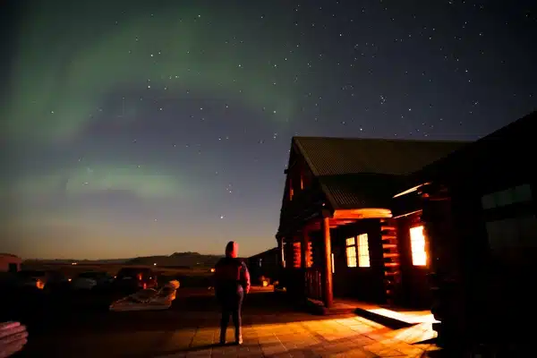 Under the aurora outside Hotel Rangá in Iceland