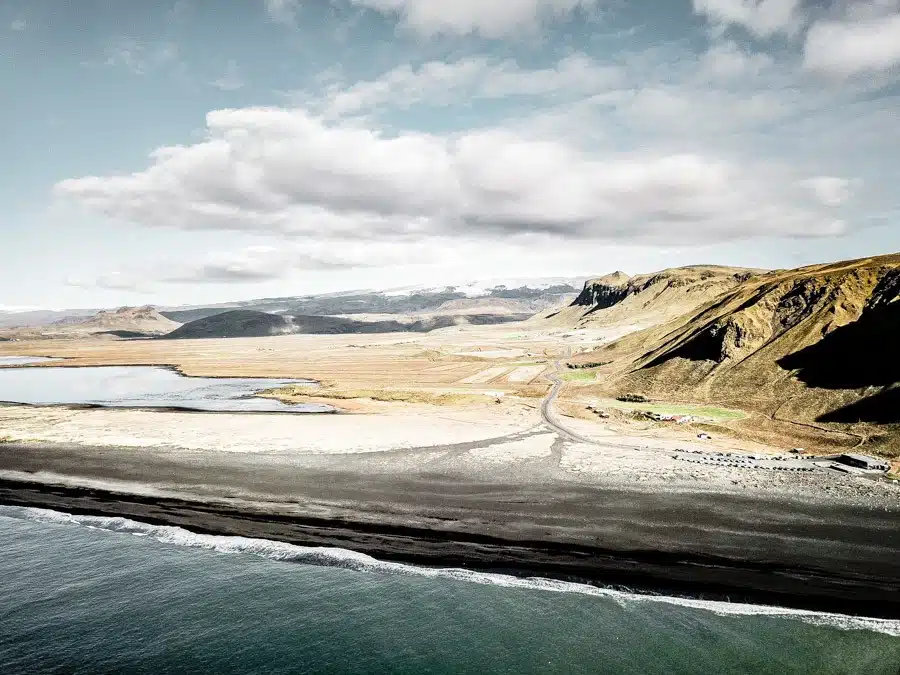 Drone photography of Vik Beach Iceland. Iceland is packed with incredible landscapes and beautiful places. Reynisfjara in Vik is one of them - a black sand beach that proves nature is a drama queen! Pure photography inspiration. #travel #iceland #travelinspiration 