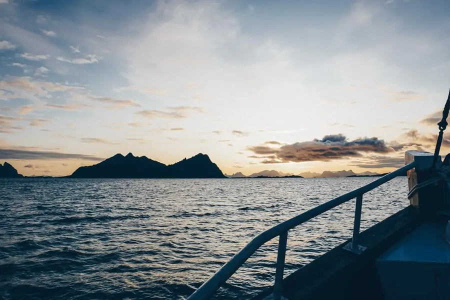 Fishing boat at sunrise Svolvaer