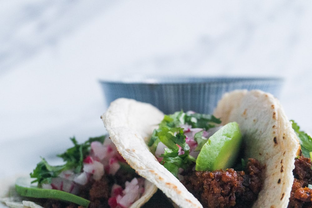Serve in tortillas with lime, avo, radish and coriander