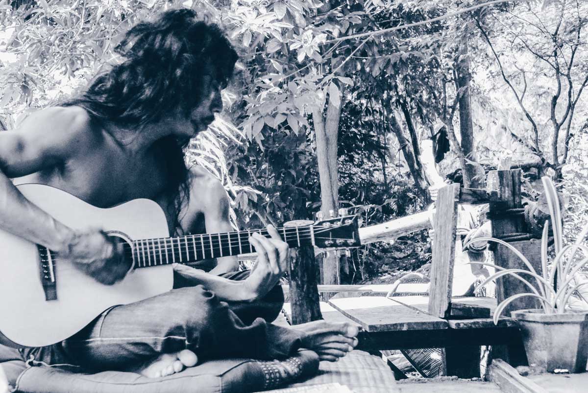 Playing a guitar in Railay