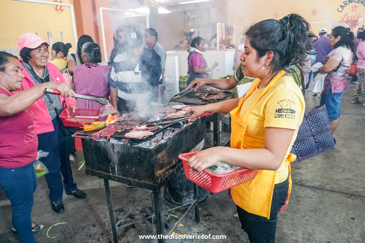 Woman cooking food at Tlacaloula