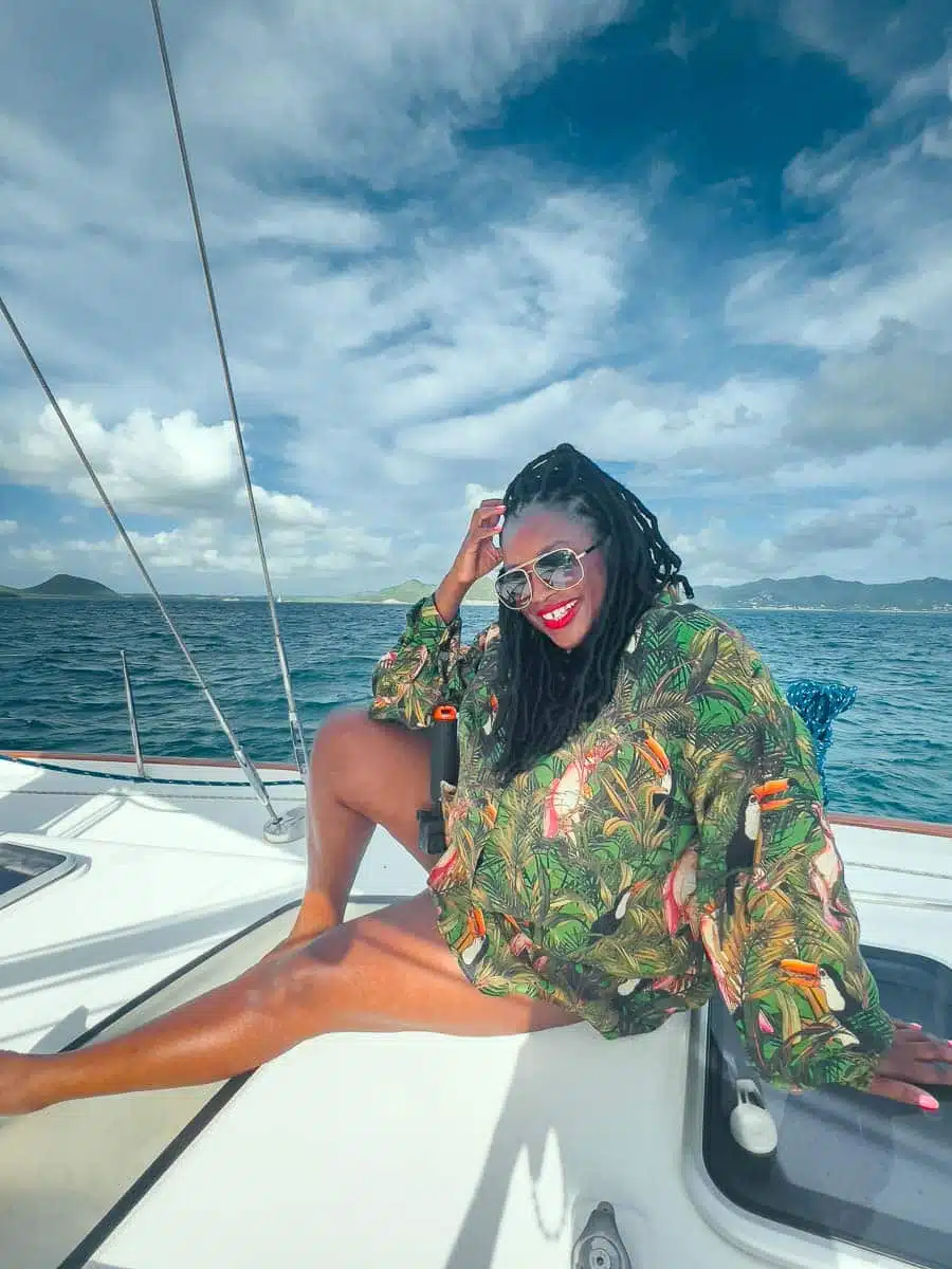 Julianna Barnaby sitting on the deck of a charter boat off the coast of Antigua