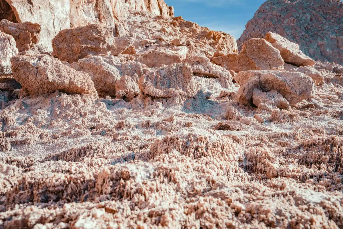 Jumbled rocks crusted with white salt in the sun at Ckamur in the Cordillera de la Sal