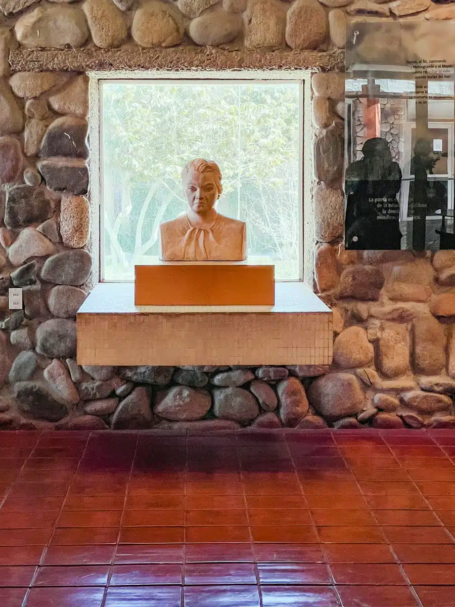 White bust of Gabriela Mistral set in a stone wall alcove at the museum in Vicuña, Chile