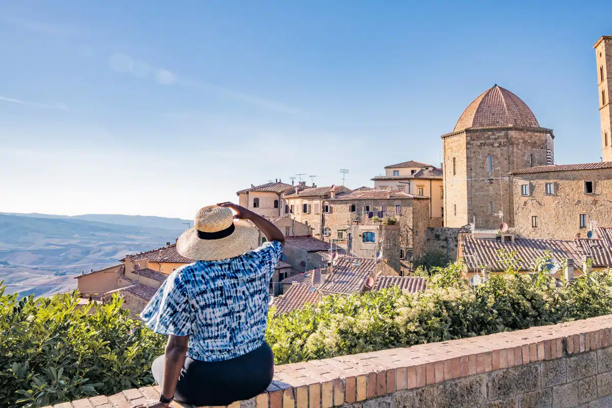 Sitting on the wall in Volterra