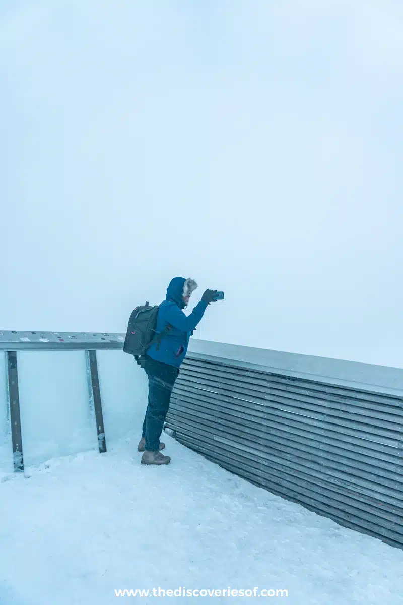 Hood up in a snowstorm at the top of the Fjellheisen cable car