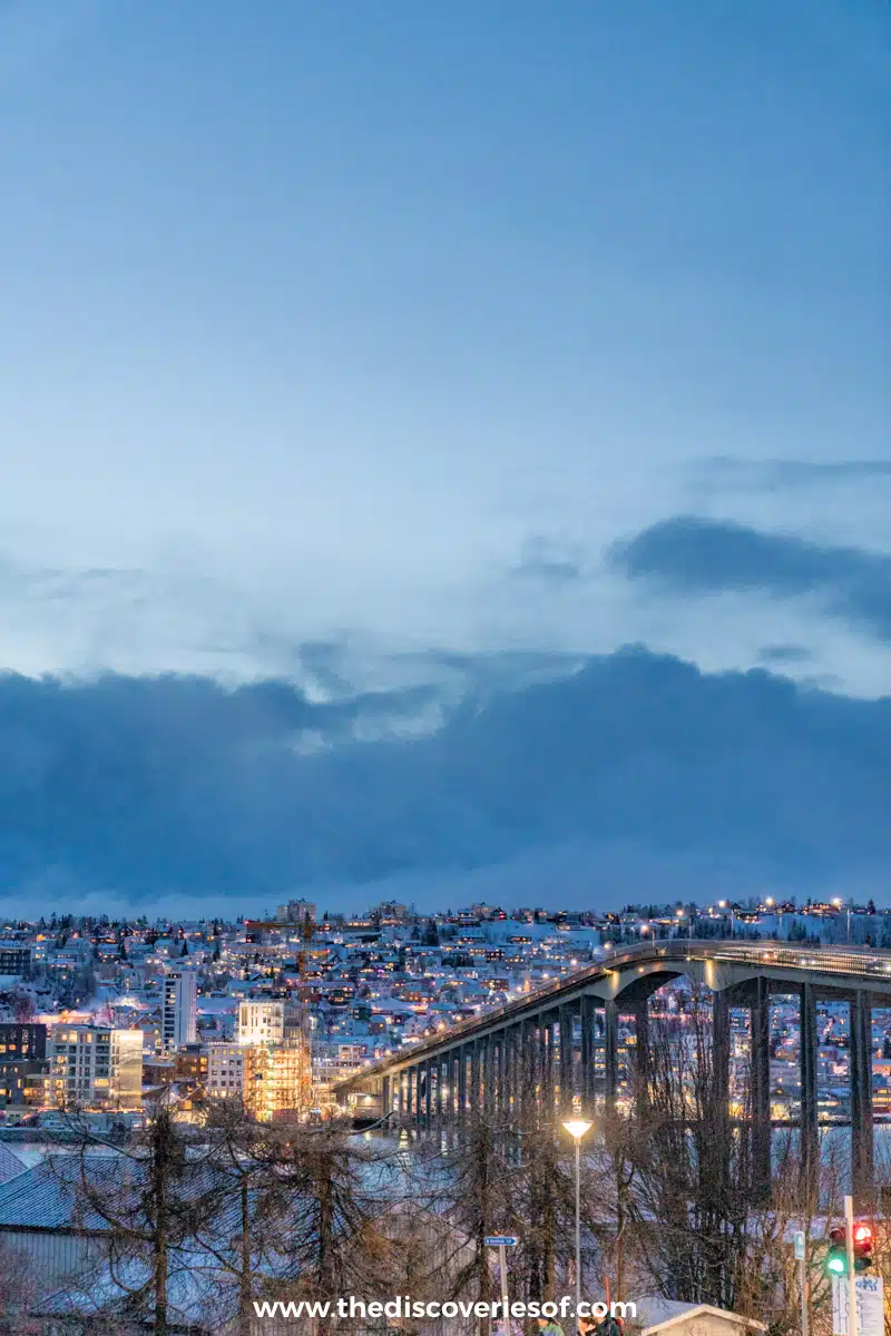 The lights of Tromsø coming on at dusk