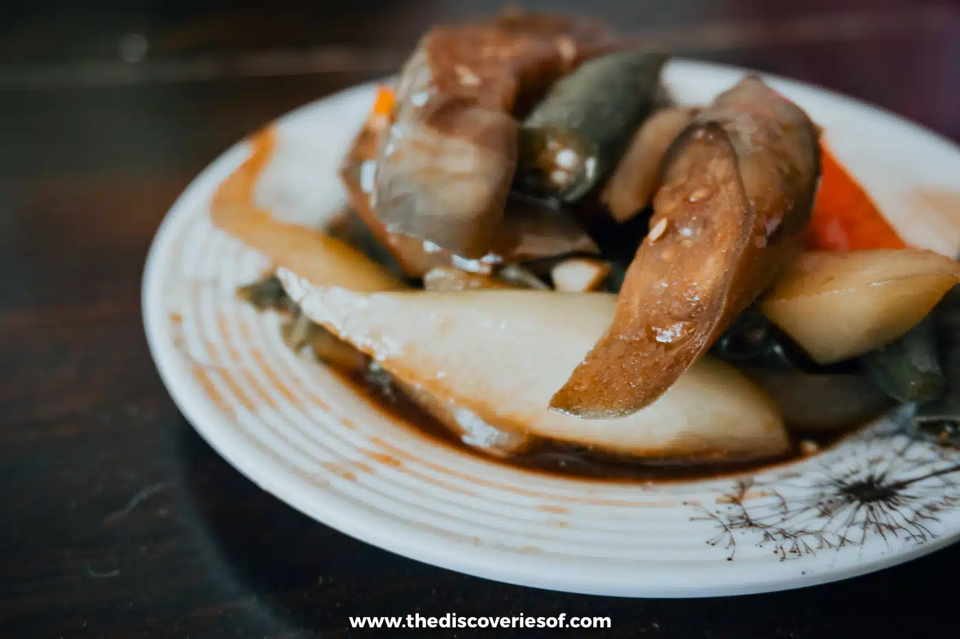 Plate of Filipino stewed vegetables with aubergine, squash and chilli at lunch on Siargao