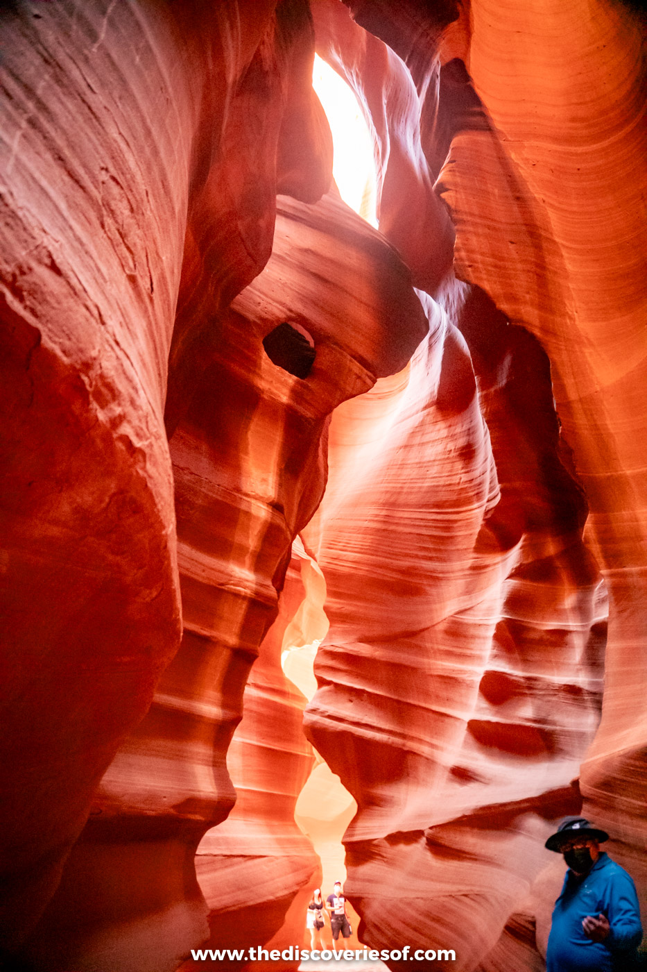 A beam of sunlight falling between the curving orange sandstone walls of Upper Antelope Canyon near Page