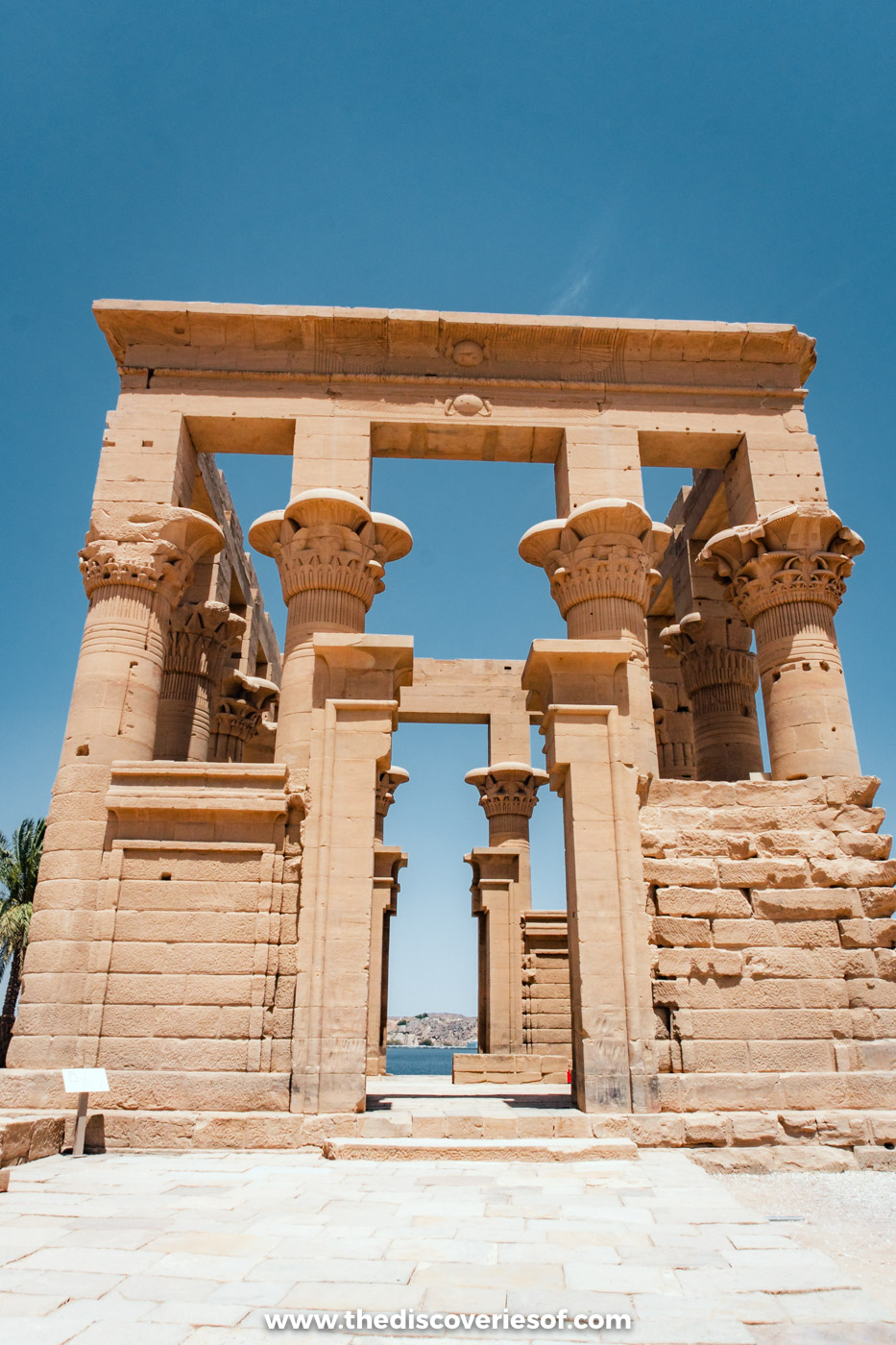 The columns of the Kiosk of Trajan at Philae Temple in Aswan under a deep blue sky
