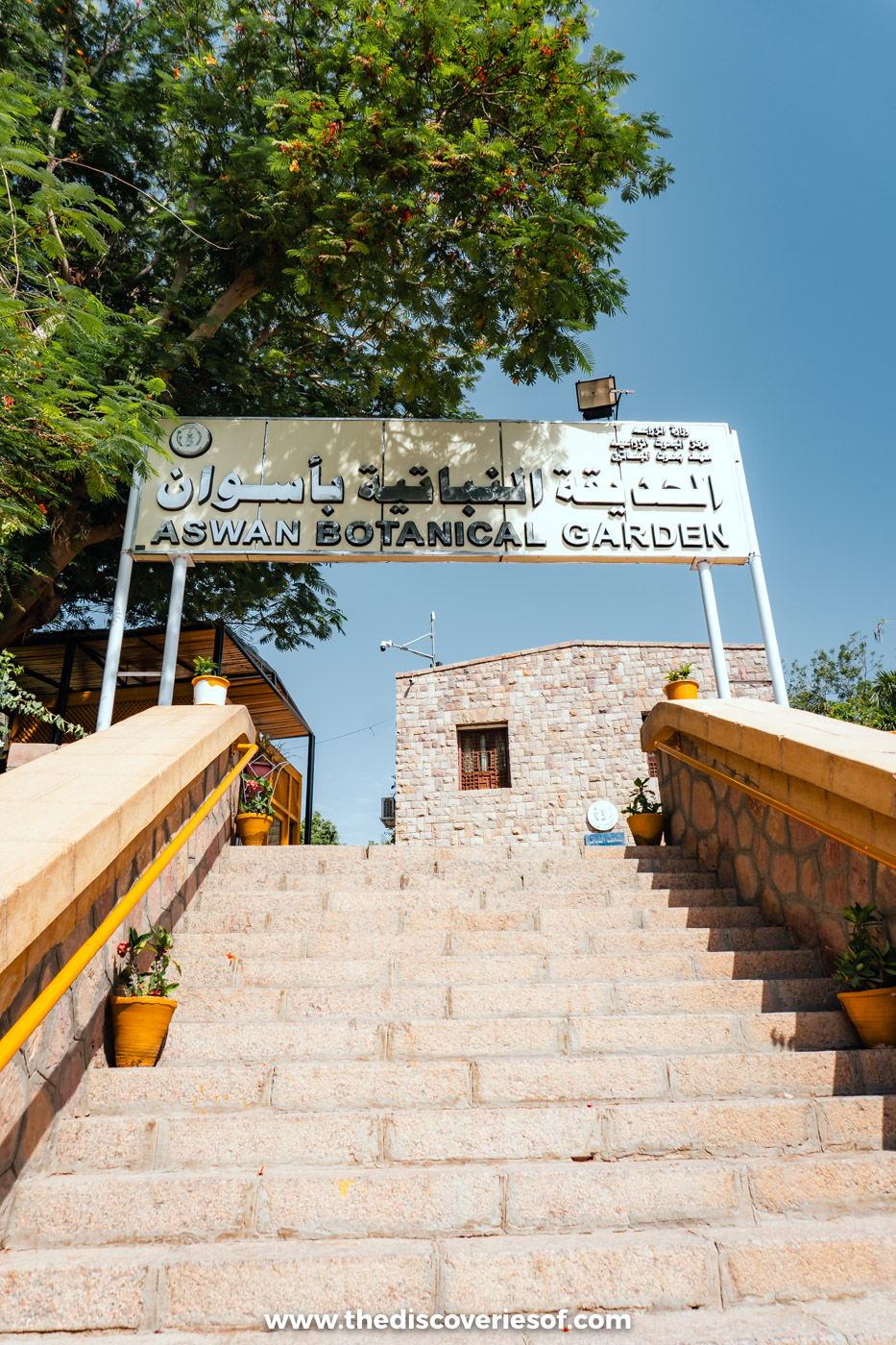 Stone steps leading up to the Aswan Botanical Garden sign and entrance building on Kitchener's Island
