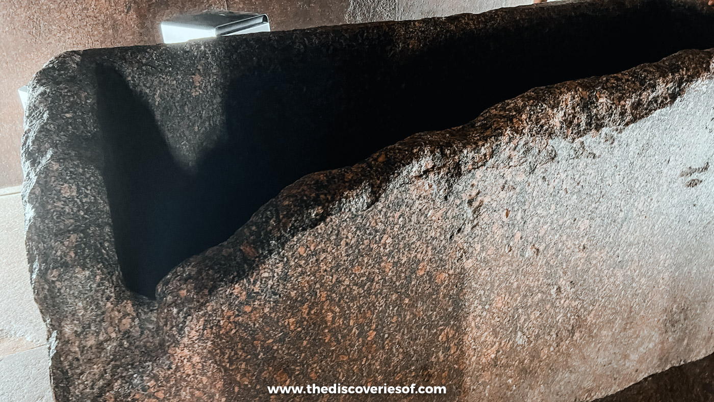 The lidless red granite sarcophagus of Khufu inside the King's Chamber of the Great Pyramid