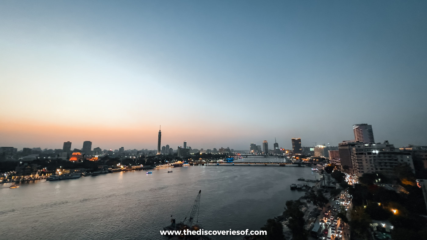 The Nile at dusk from the Kempinski Nile Hotel rooftop in Garden City, with the Cairo Tower on the skyline