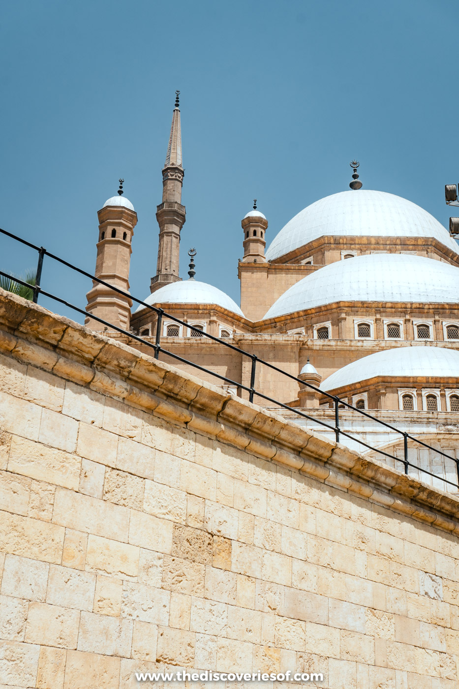 The domes and twin pencil minarets of the Mosque of Muhammad Ali above the Citadel walls in Cairo