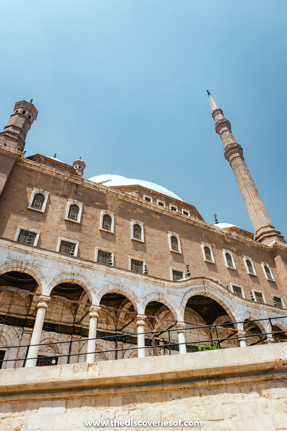 The arcaded facade, dome and tall minarets of the Mosque of Muhammad Ali at the Cairo Citadel