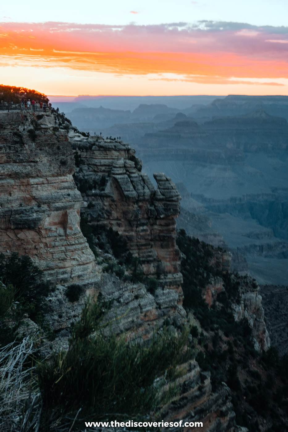 The sky glowing orange over Mather Point at sunset, Grand Canyon
