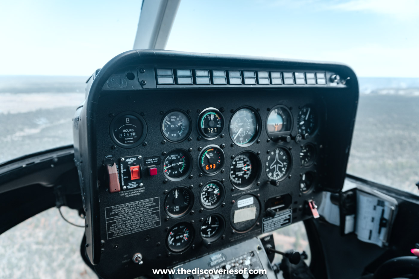 The cockpit of a Papillon helicopter flying towards the Grand Canyon