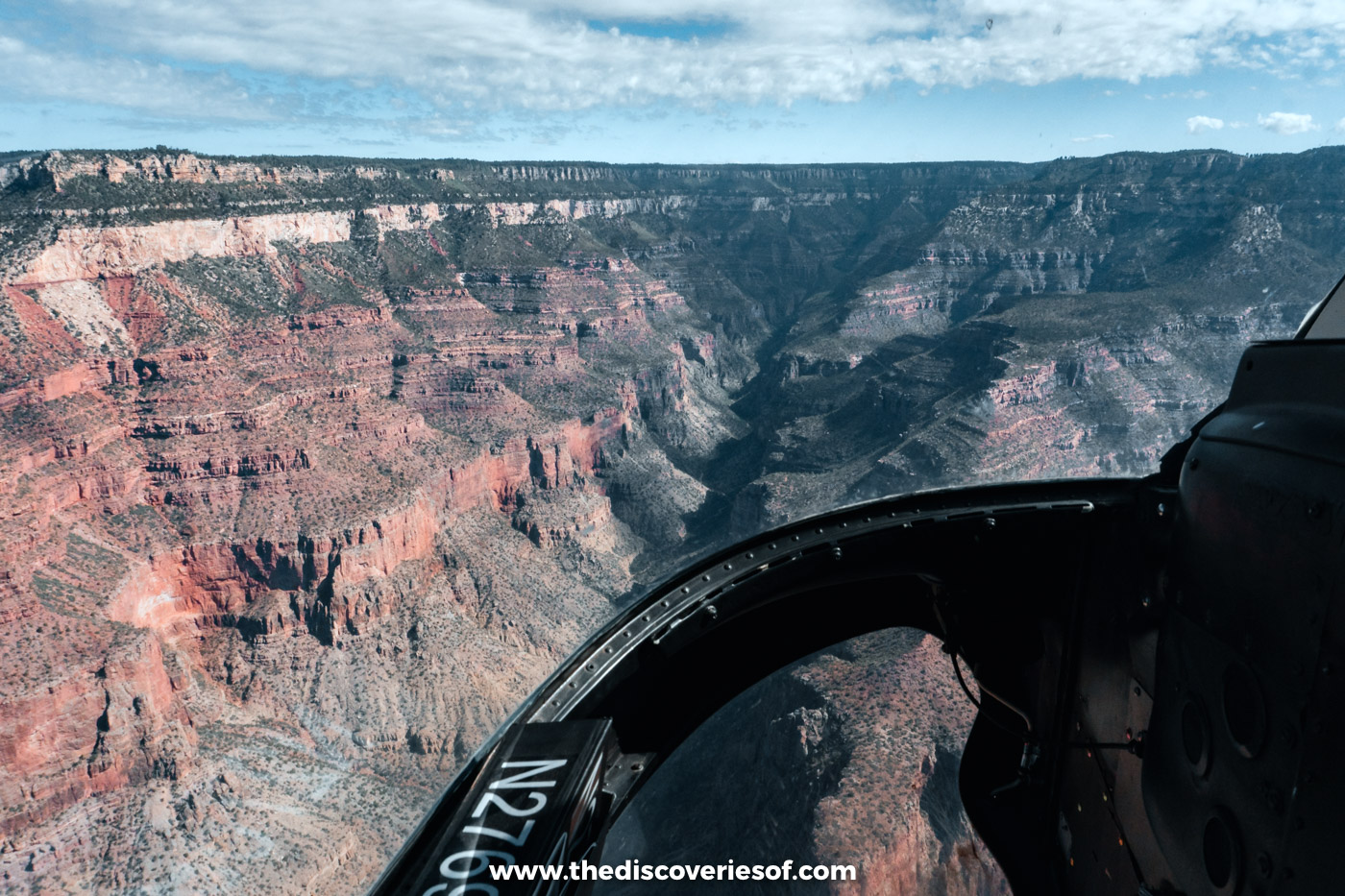 The red walls of the Grand Canyon seen through the windscreen of a Papillon helicopter