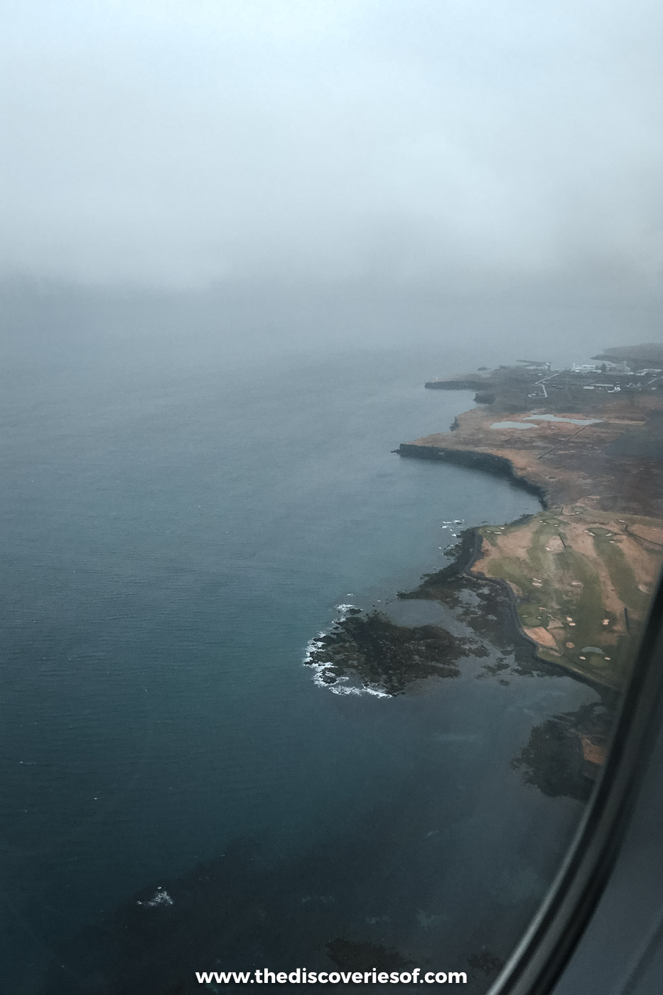Coastline seen from the plane window while coming in to land at KeflavÃk airport in Iceland in May
