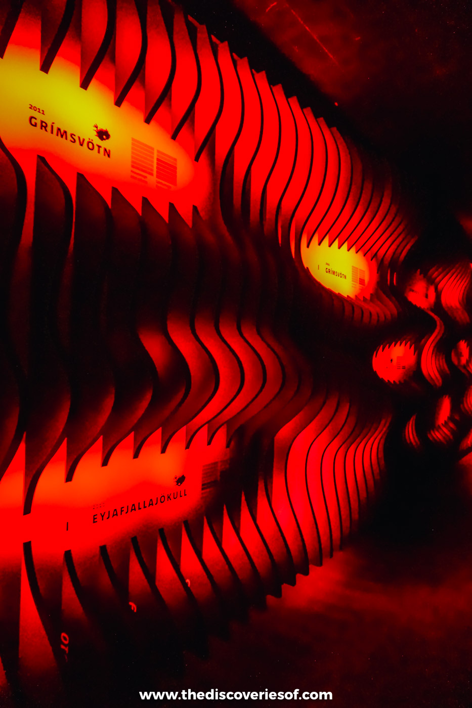 Red-lit sculpted magma exhibit glowing inside the LAVA Centre volcano museum in Hvolsvöllur