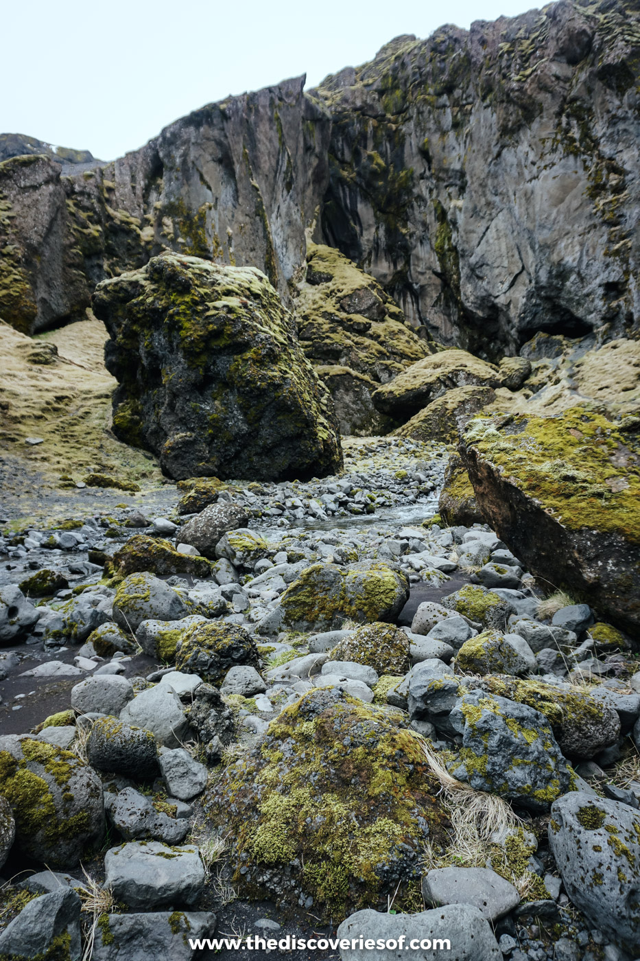 Moss-covered boulders and rock walls in a narrow gorge on a super jeep day in south Iceland in May