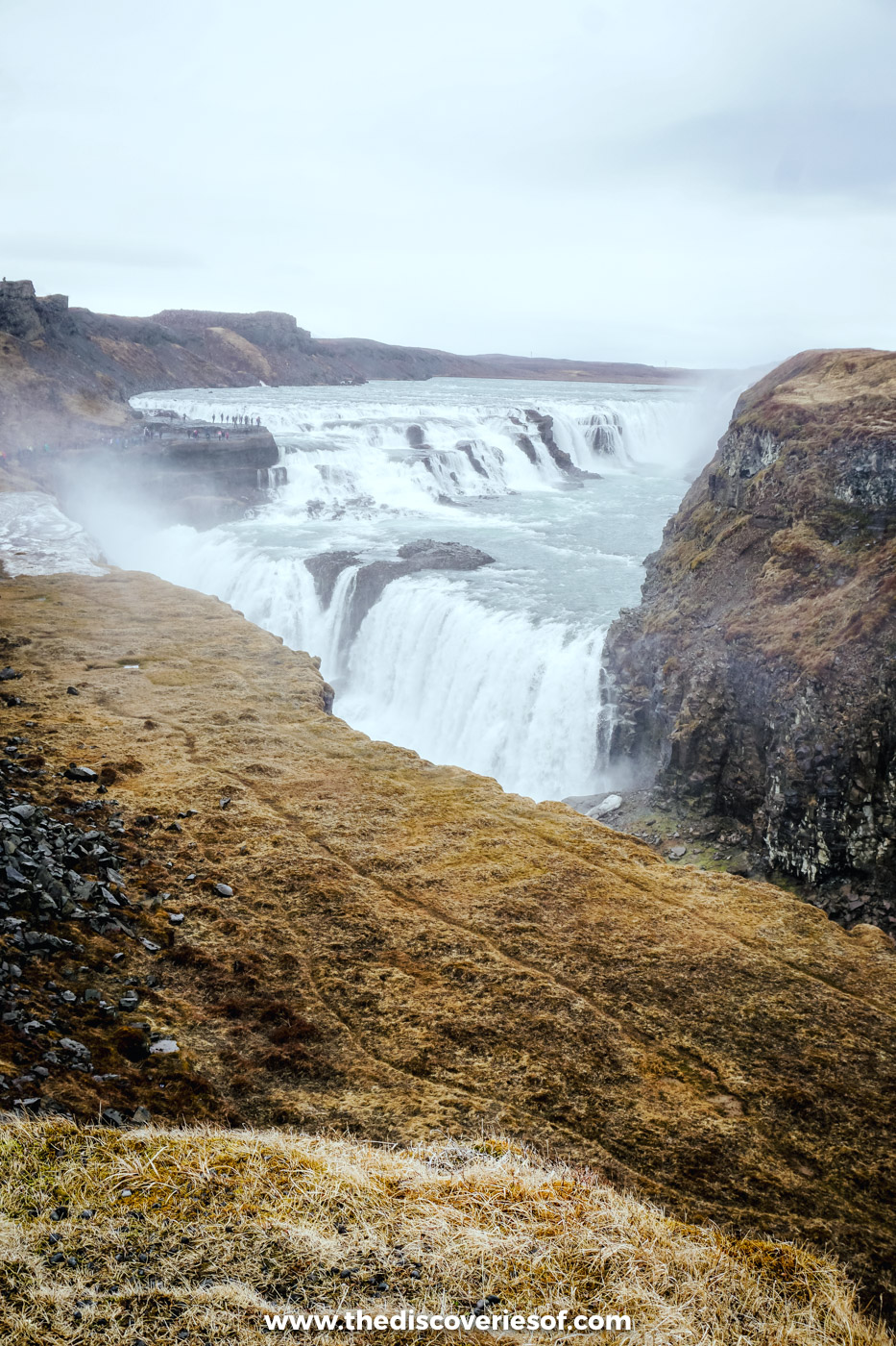 The upper tier of Gullfoss pouring into the HvÃtá canyon under a grey May sky, Golden Circle, Iceland