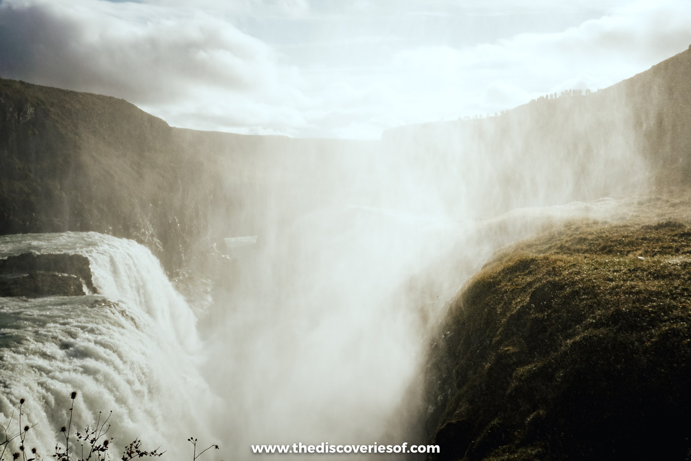 Sunlit spray filling the canyon beside Gullfoss waterfall on a bright late September afternoon