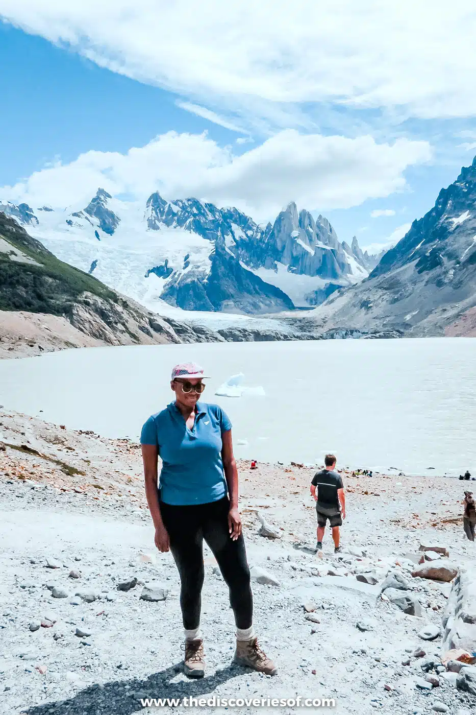 Julianna Barnaby on the moraine at Laguna Torre with the glacier and peaks behind, El Chaltén, Argentina