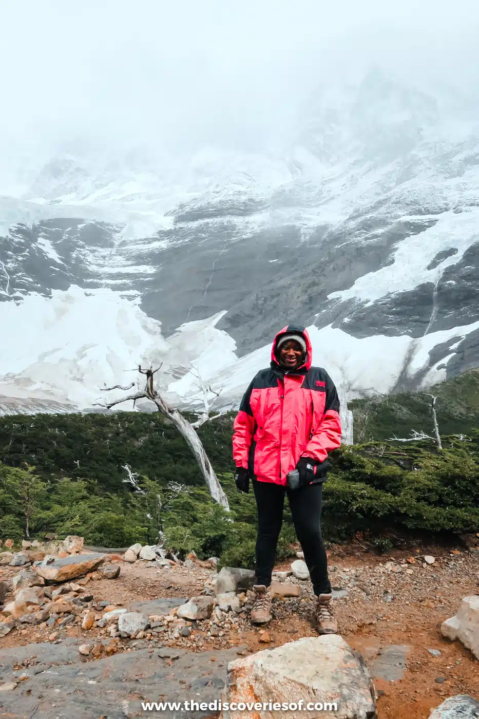 Julianna Barnaby in a red jacket below a snowy glacier in the Francés Valley, Torres del Paine