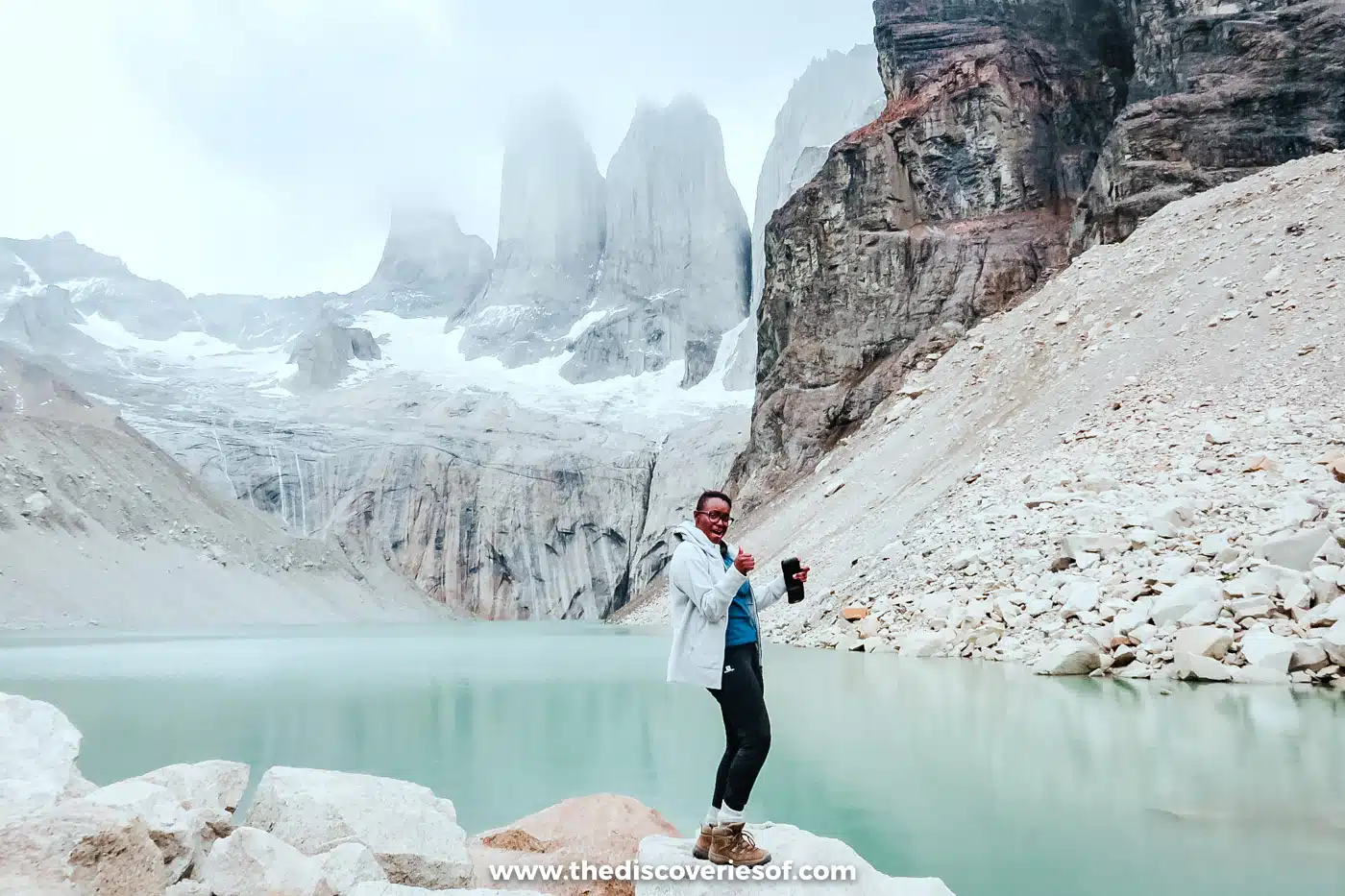 Julianna Barnaby celebrating at the base of the Torres del Paine towers, Chile