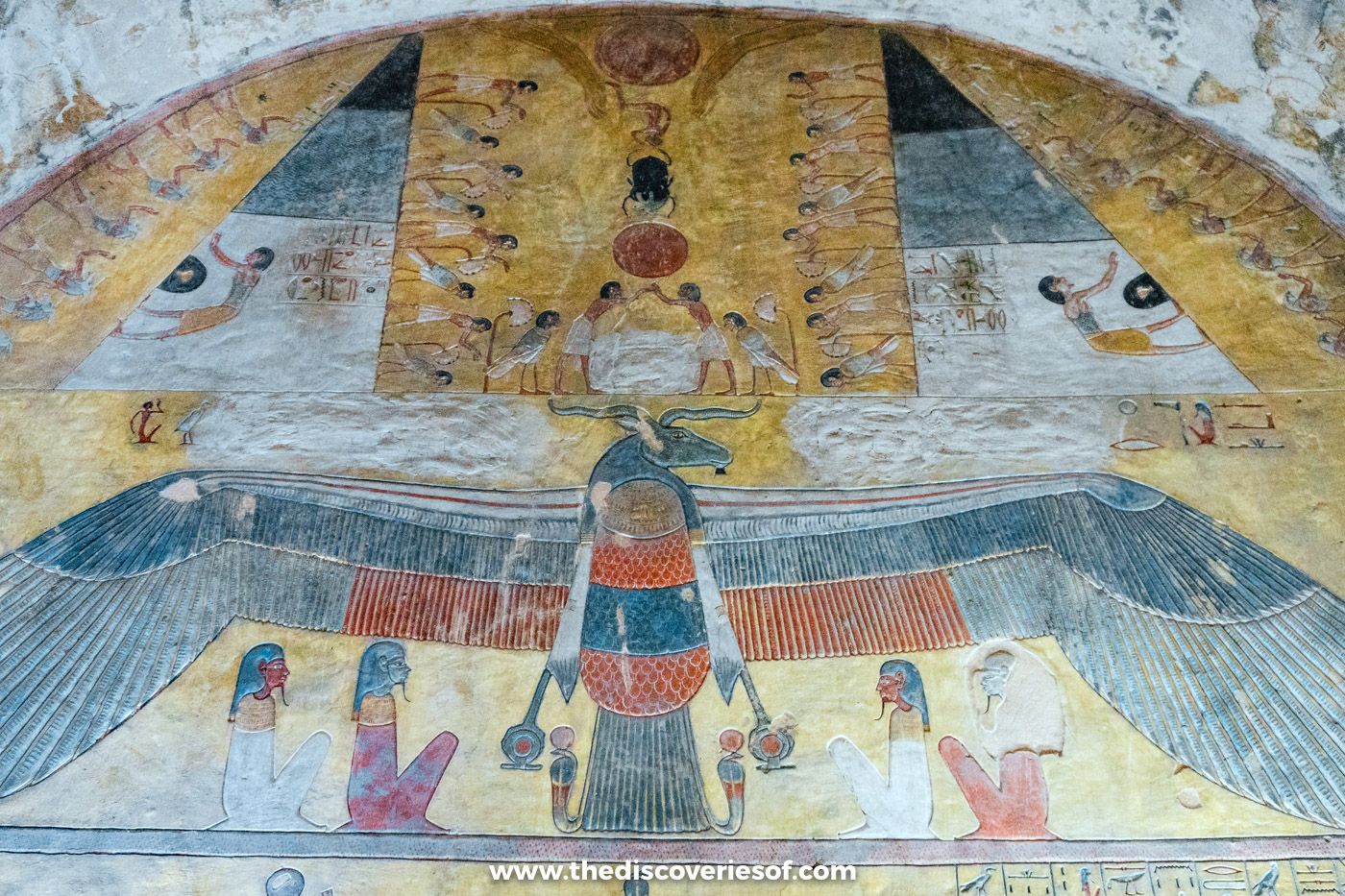 Colourful lunette with a winged deity and kneeling gods in the first burial chamber of tomb KV14