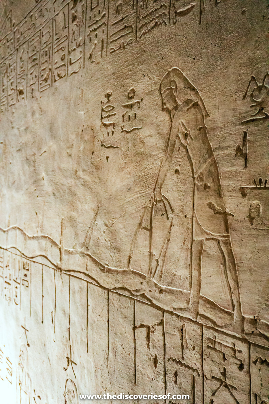 Unpainted sunk relief of a figure from the Amduat carved into the corridor wall of tomb KV14, Luxor