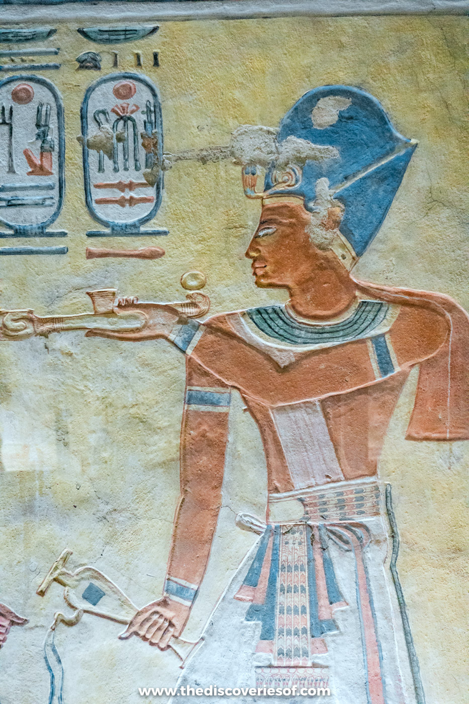 Painted relief of Ramses III wearing the blue crown and holding an offering in the tomb of Khaemwaset