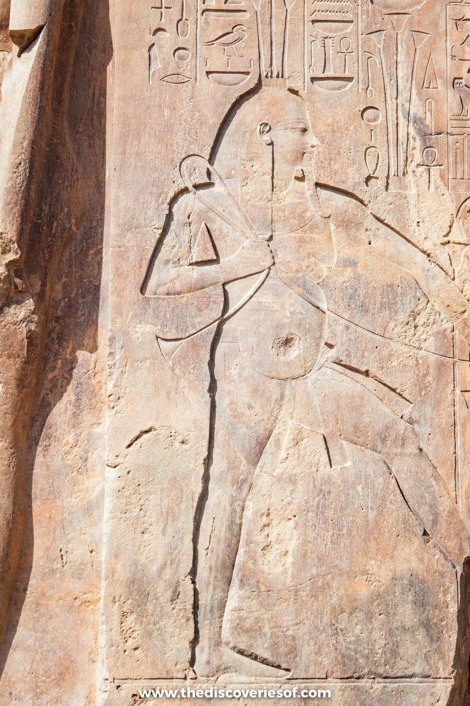 Carved relief of the Nile god Hapi binding plants on a throne at the Colossi of Memnon, Luxor