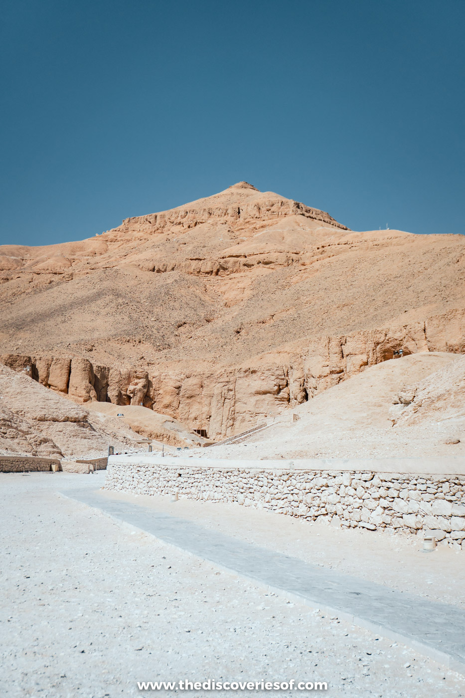 A paved path leading up between limestone cliffs into the Valley of the Kings on the West Bank of Luxor