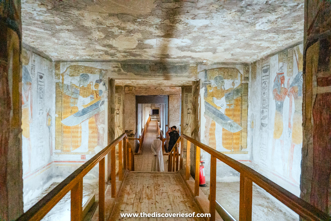 Walkway through a series of doorways flanked by painted winged goddesses deep inside tomb KV14, Luxor