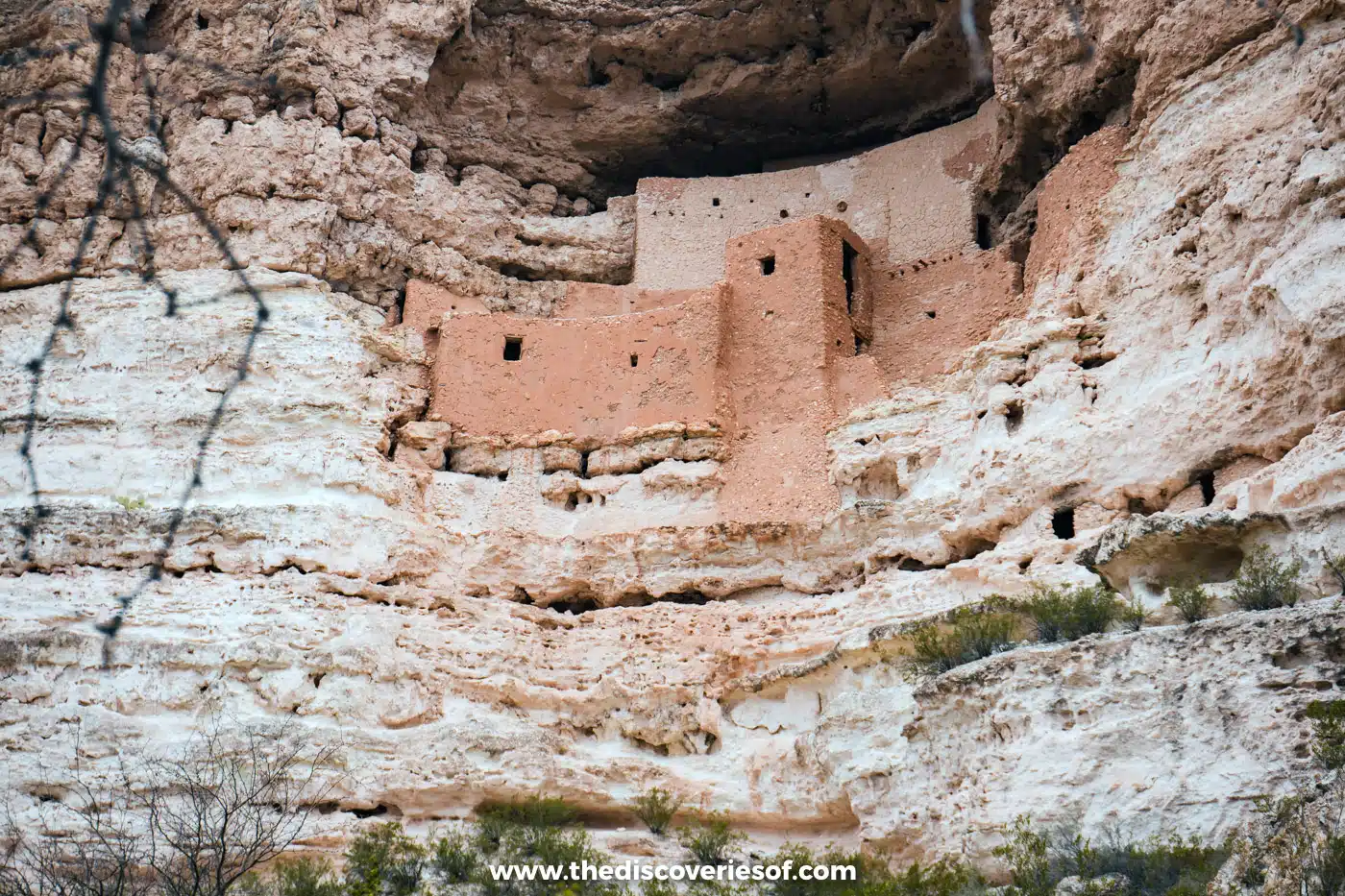 Close-up of the tower, walls and small windows of Montezuma Castle in its limestone cliff alcove