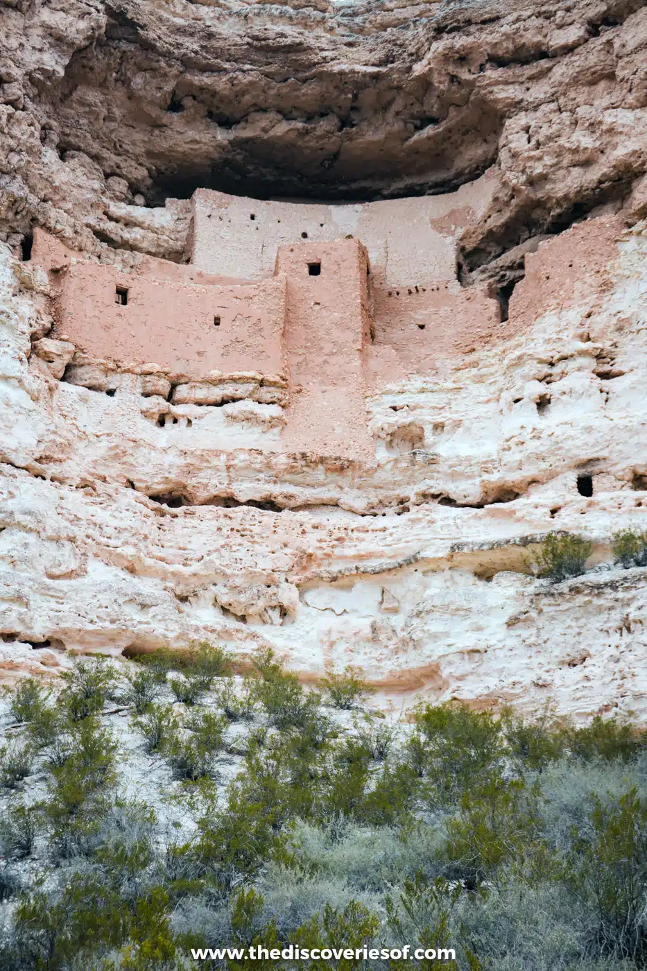 The five-storey Sinagua cliff dwelling of Montezuma Castle above desert shrubs in the Verde Valley, Arizona