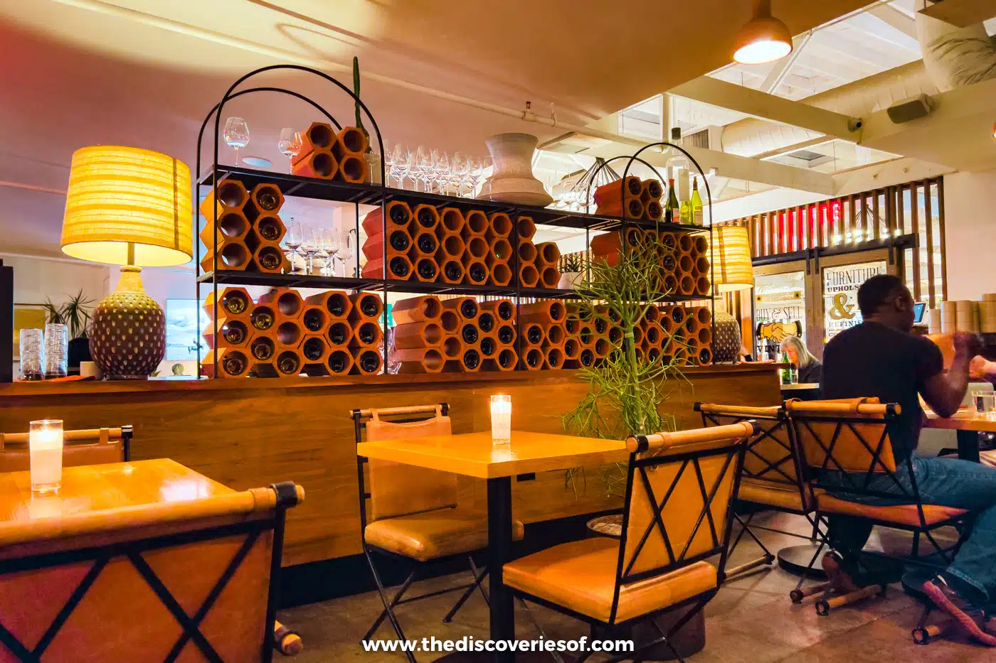Wooden shelves and dining tables inside Valentine restaurant in Phoenix, Arizona