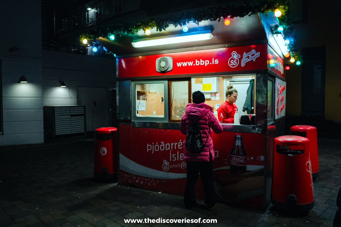 The Bæjarins Beztu Pylsur hot dog stand lit up at night in central Reykjavik