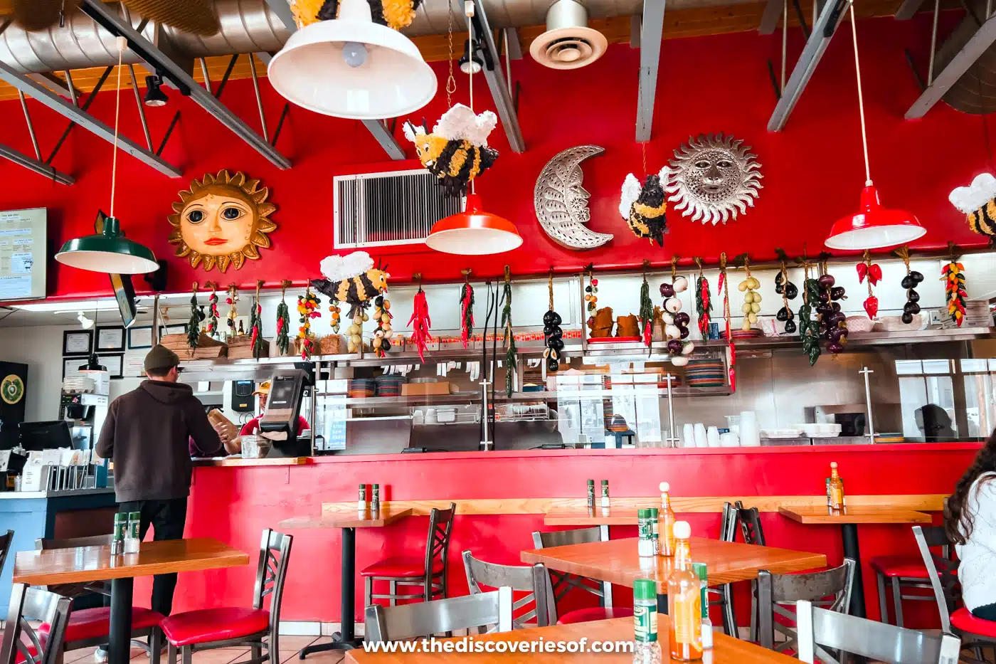 The red, bee-decorated order counter and dining room at Bumble Bee's Baja Grill in downtown Santa Fe