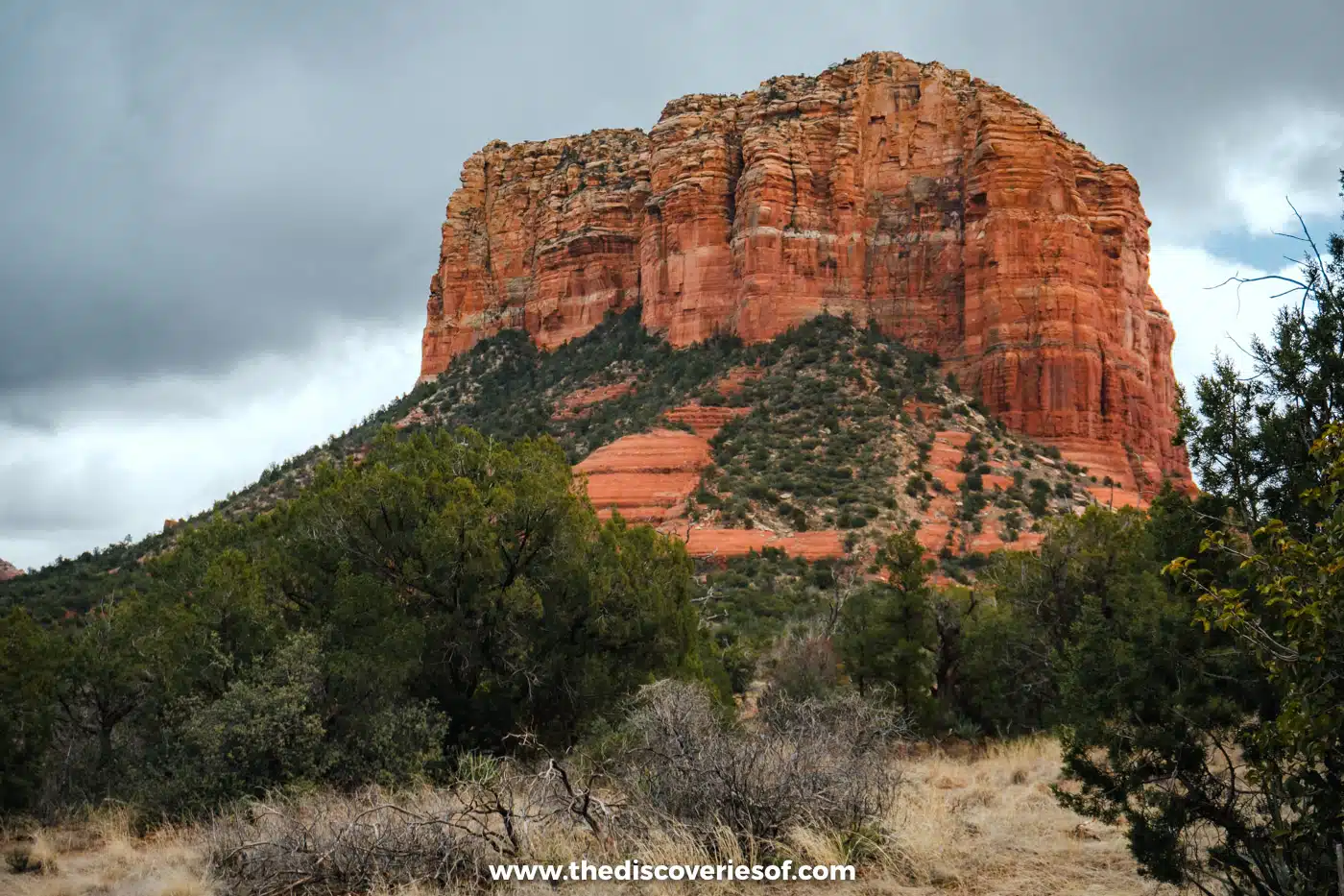 Courthouse Butte towering over green juniper and pinyon woodland near Sedona